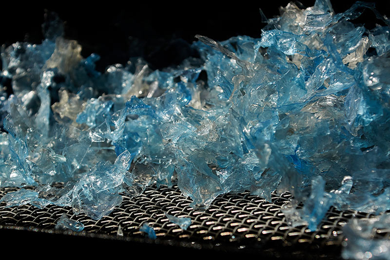 plastic flakes being processed at the makers place artist recycling studio