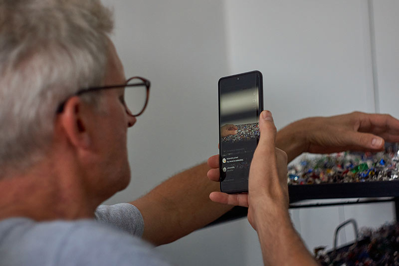 artist alexander james photographing the results in the aluminium recycling studio