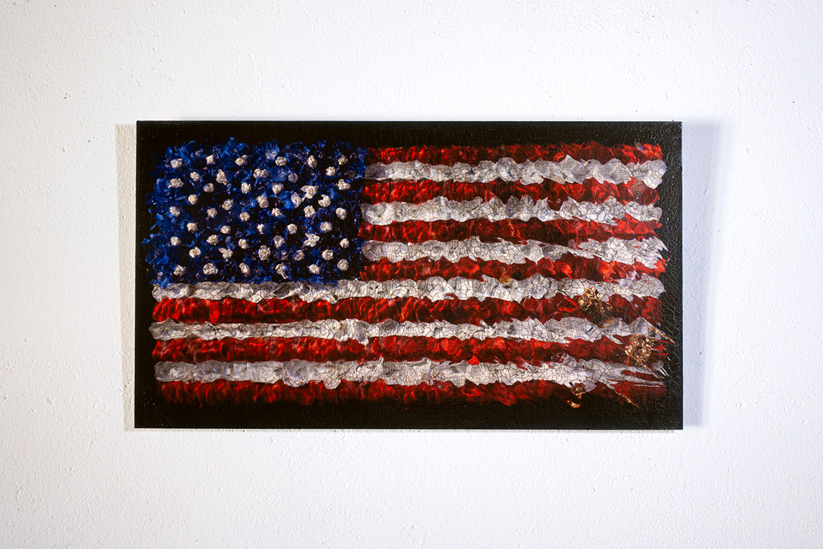 an aged american flag in oil