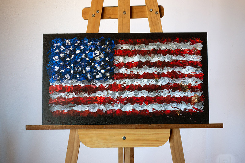 the american flag on an easel in the studio