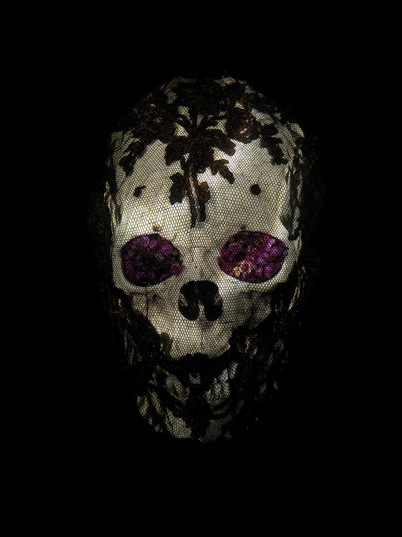 veiled skull with flowers from a beautiful announcement of death