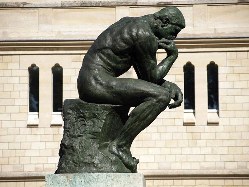 a contemporary artist reworks the Thinker by Auguste Rodin seen here in Museum garden Paris 1904