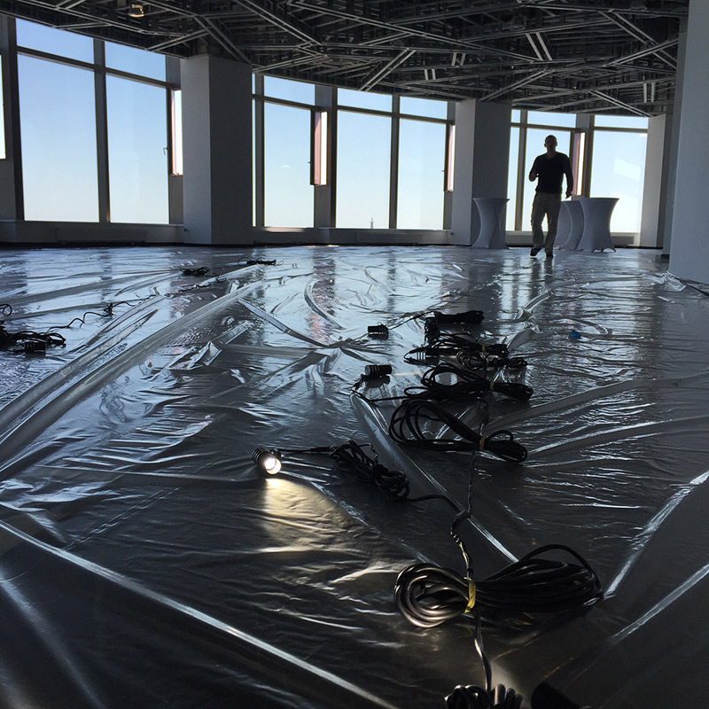 lighting a raw and bare floor plate in a building for an art exhibition bullet lighting