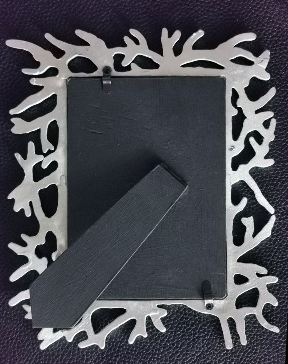 rear of sea coral picture frame in silver and black